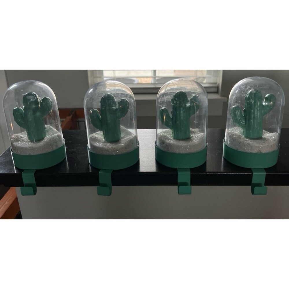 Cactus-themed snow globe stocking holder. Quantity 4.